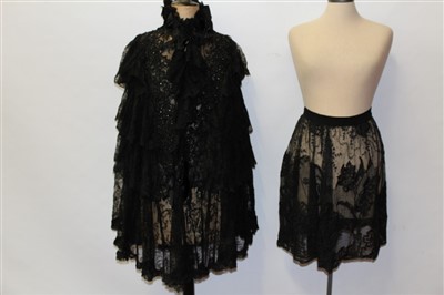 Lot 3105 - 19th Century French lace and ribbon cape plus a black lace apron