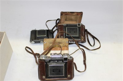 Lot 3796 - Three Zeiss folding cameras, a metered Super Ikonta B with ‘T’ coated Tessar, another unmetered version and an Ikonta B, all cased