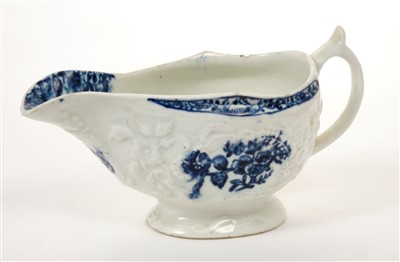 Lot 151 - 18th century Lowestoft blue and white sauce boat with printed and moulded floral decoration