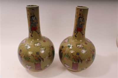 Lot 2202 - Pair of large 20th century Oriental bottle vases with figure and floral decoration on green ground – seal mark to base, 44cm high