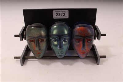 Lot 2212 - Set of three impressive Kosta Boda Bertil Vallien head sculptures – all signed and numbered, in original metal rack