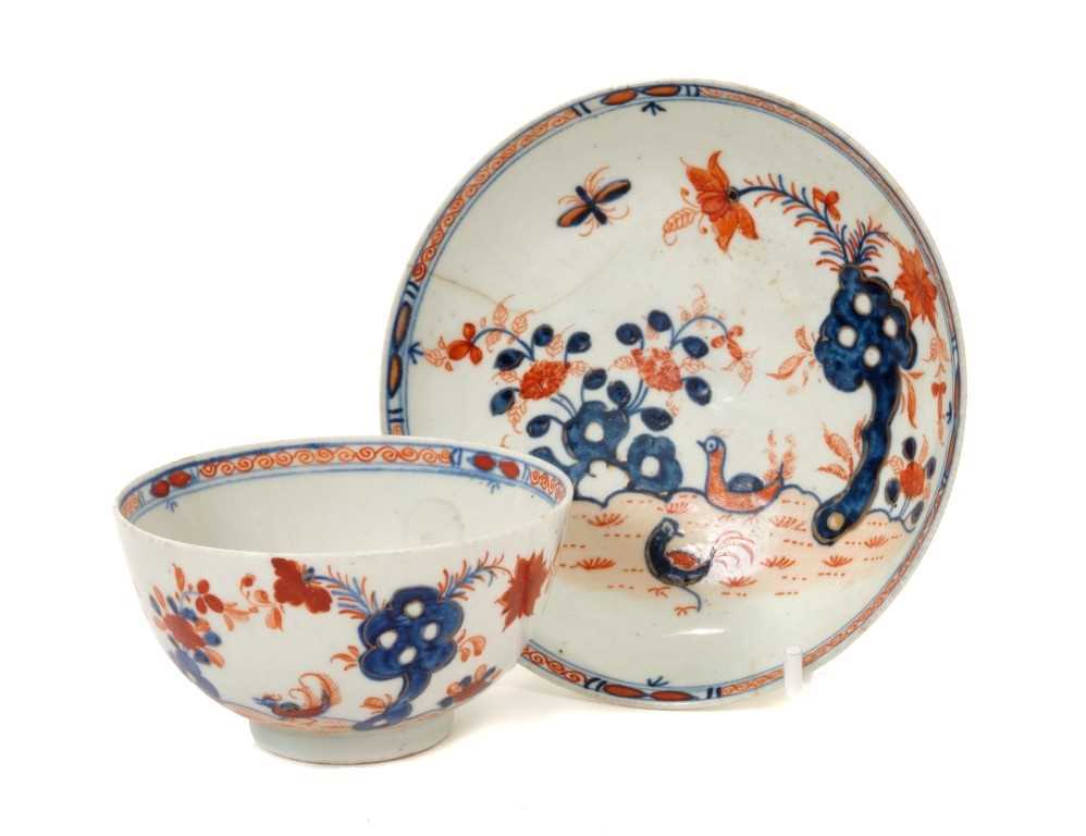 Lot 160 - 18th century Lowestoft Imari palette tea bowl and saucer with two bird pattern decoration