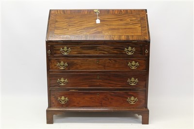 Lot 1520 - George III flame mahogany bureau