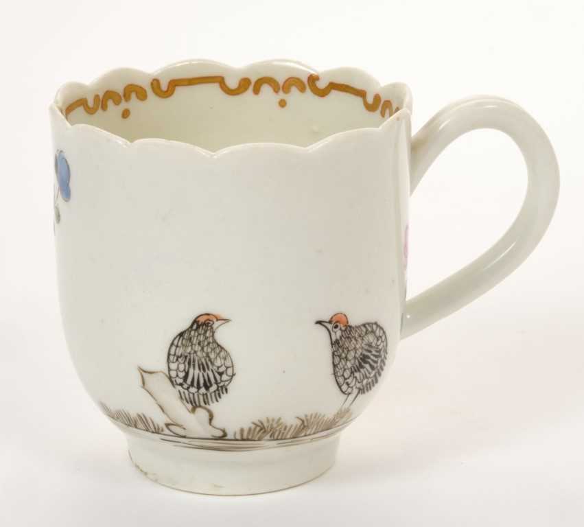 Lot 180 - 18th century Worcester coffee cup, polychrome two quail, rock and floral decoration, 6.2cm