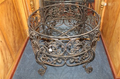 Lot 1568 - Impressive wrought iron table base, cylindrical form, with ornate scrolling foliate ornament on scrolled feet, 95cm diameter