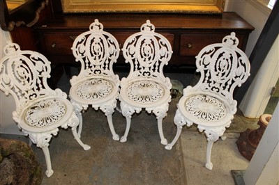 Lot 1573 - Victorian-style aluminium garden table and set of four chairs, white painted, the circular table on mask cast cabriole legs