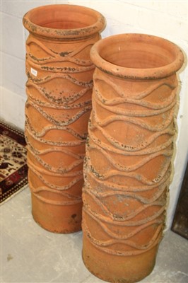 Lot 1574 - Impressive pair of Victorian terracotta chimney pots, cylindrical form, with applied geometric ornament, 94cm high