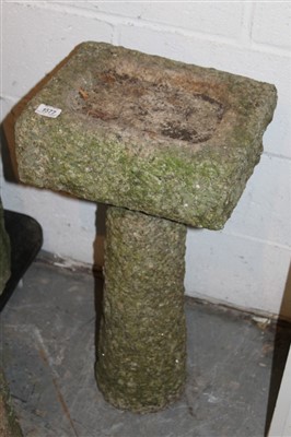 Lot 1577 - Carved granite bird bath, square form, on flared cylindrical column, 36cm wide