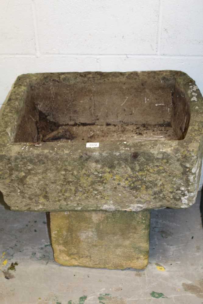 Lot 1578 - Carved granite sink, rectangular form, raised on square plinth, approximately 68cm wide