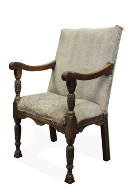 Lot 1463 - Highly unusual early, possibly Elizabethan, carved walnut open armchair with upholstered square back and seat and scroll arms, on stop-fluted baluster carved supports, evidence of solid plank seat,...