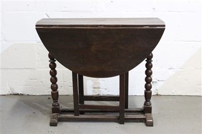 Lot 1464 - Late 17th century oak gateleg table, elliptical drop-leaf top on bobbin-turned end supports with primitive square section gates, 80cm wide