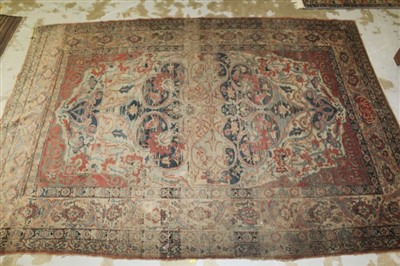 Lot 1467 - Antique Kashan rug with central concentric medallion on brick-red ground and multiple meander borders, signature panel to one end, 164cm x 222cm