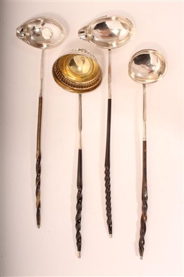 Lot 404 - Four Georgian silver toddy ladles with turned whalebone handles