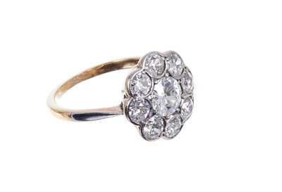 Lot 647 - Diamond cluster ring with a flower-head cluster of old cut diamonds