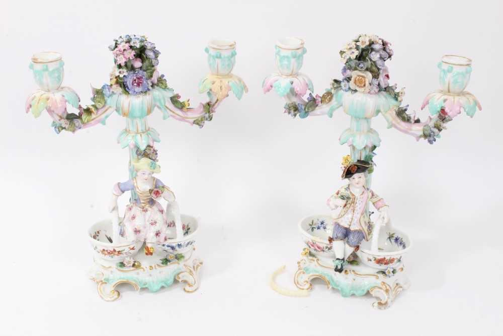 Lot 68 - Pair late 19th century Dresden figural twin-branch porcelain candelabras