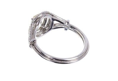 Lot 660 - Diamond double-halo cluster ring, natural fancy yellow oval brilliant cut diamond weighing 1.06cts