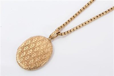 Lot 599 - Engraved gold locket on chain