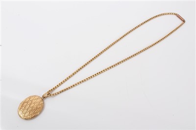 Lot 599 - Engraved gold locket on chain