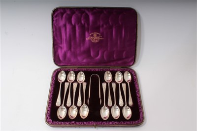 Lot 468 - Set of twelve Victorian silver teaspoons and matching sugar tongs, in original fitted case - London 1890