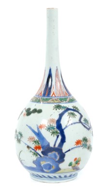 Lot 214 - Late 17th Century Chinese Imari bottle vase with famille verte tree and rock decoration, 25cm