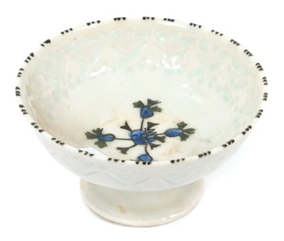 Lot 220 - 18th century Iznik pottery pedestal bowl with translucent glazed cut and floral painted decoration