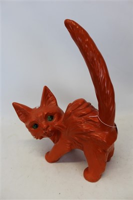 Lot 2026 - Mid twentieth-century pottery ornament of an over characterful cat with orange glazed body and green eyes 41.5cm high