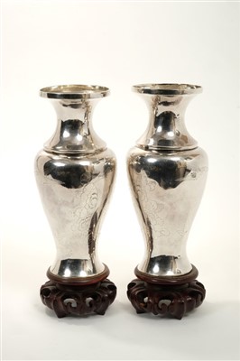Lot 211 - Pair Chinese white metal vases on carved wooden stands