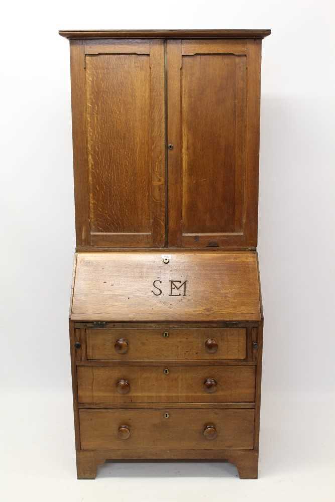 Lot 862 - George III oak and pine country bureau cabinet