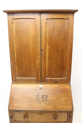 Lot 862 - George III oak and pine country bureau cabinet