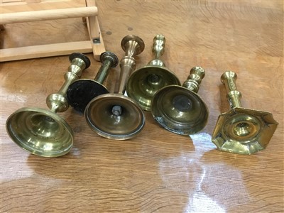 Lot 850 - Pair of early 18th century brass candlesticks