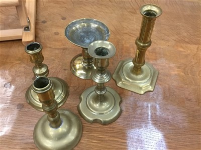 Lot 850 - Pair of early 18th century brass candlesticks