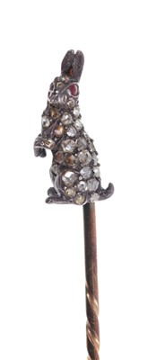 Lot 555 - Antique diamond novelty stick pin in the form of a rabbit with red stone and pavé set diamonds in silver setting