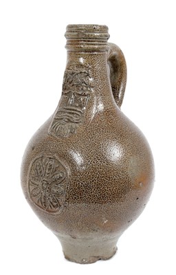 Lot 200 - 17th century Rhenish stoneware Bellarmine bottle with string collar, 23cm high
