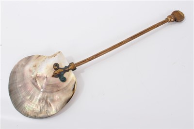 Lot 868 - Unusual mother of pearl gilt spoon with moon face finial