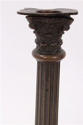 Lot 133 - Pair of 19th century bronze Corinthian column candlesticks