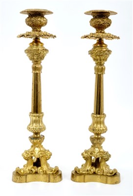 Lot 1048 - Pair of early 19th century ormolu candlesticks