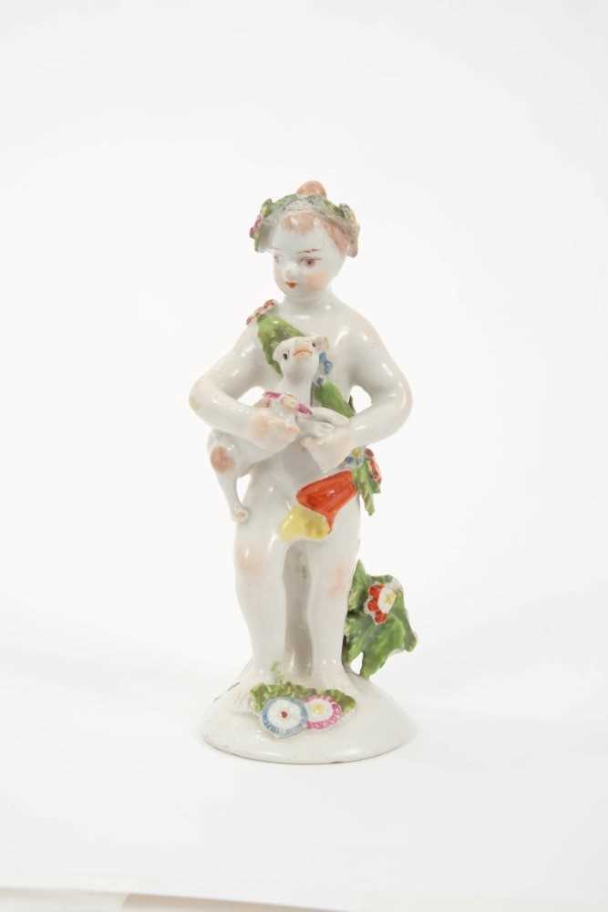 Lot 189 - 18th century Bow porcelain putti holding a dog, circa 1760, 11.5cm