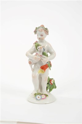 Lot 281 - 18th century Bow porcelain putti holding a dog, circa 1760, 11.5cm