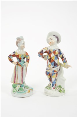 Lot 282 - Two 18th century Derby figures of Harlequin and Columbine with polychrome chequered costumes