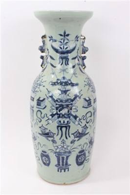 Lot 312 - Late 19th century Chinese celadon blue and white painted vase with lion handles, 58cm