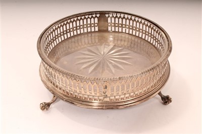 Lot 430 - George III silver wine coaster of circular form, with pierced decoration and turned wooden base