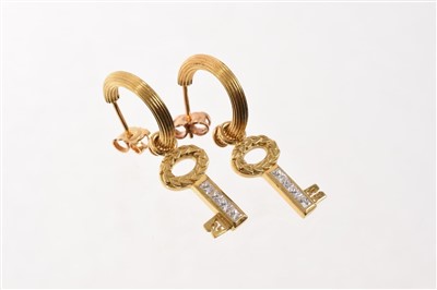 Lot 714 - Pair of Theo Fennell 18ct gold hoop and key drop earrings