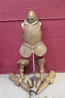 Lot 566 - Victorian 'theatrical' copy suit of armour comprising breast plate, helmet, gauntlets and vambrace