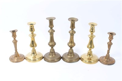 Lot 730 - Three pairs of 18th / 19th century brass candlesticks, the tallest 28cm