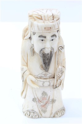 Lot 732 - Chinese carved ivory deity figure depicted holding a ruyi sceptre