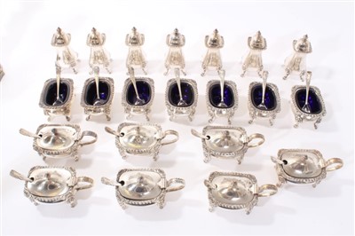 Lot 235 - Set of seven silver plated mustards, seven matching salts, seven matching peppers,  fourteen spoons