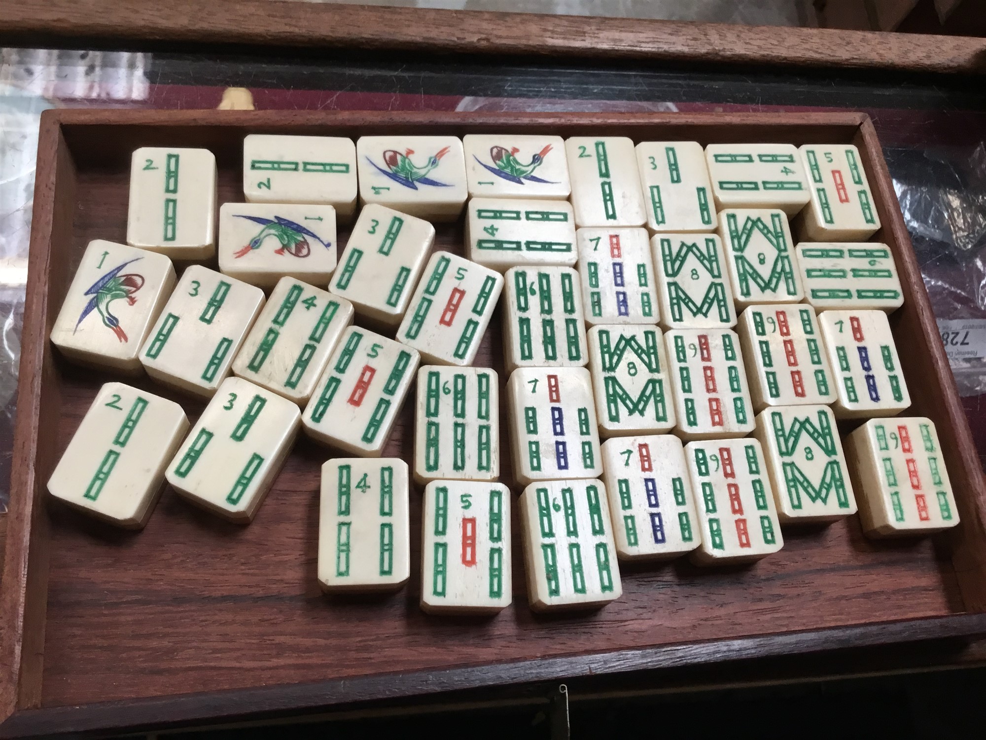 A Chinese Mahjong set, early 20th century, with bone and bamboo tiles,  contained within a five drawe