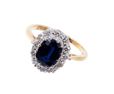 Lot 408 - Sapphire and diamond cluster ring