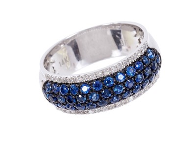 Lot 412 - Sapphire and diamond ring.