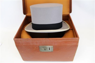 Lot 3057 - Gentleman's vintage black top hat by Christy's London retailer Dudley Beck Hatter Chester in fitted leather hat case with red silk lining.  Plus a grey top hat 'The Woodrow' in a square leather fit...